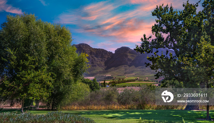 franschhoek wine valley views from a garden with blue sky clouds in Cape Town western cape South Africa