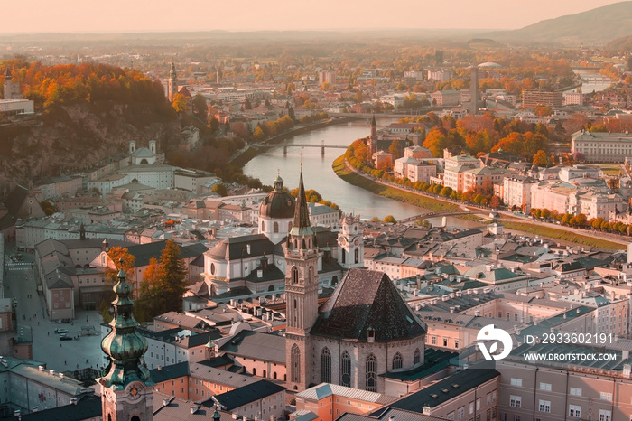 Beautiful view in a Autumn season at a historic city of Salzburg with Salzach river in beautiful golden evening light sky and colorful of autumn at sunset, Salzburger Land, Austria