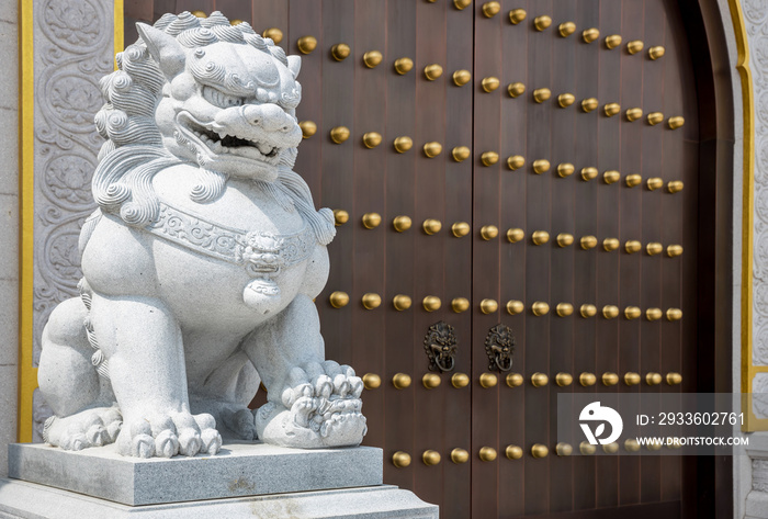 Stone Lion statue in front gate of Temple. Stone lion in China. Stone lion statue of wood gate.