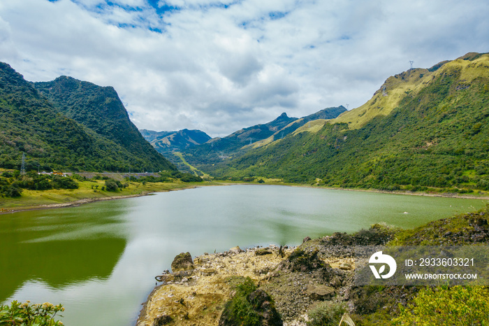 Beautiful lagoon located in Papallacta, the Andean highlands in a sunny day, with the mountains behinds in Quito Ecuador