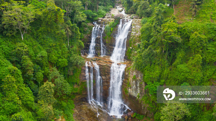 Waterfall in a tropical forest. Aerial view of Lower Ramboda Falls. Sri Lanka.