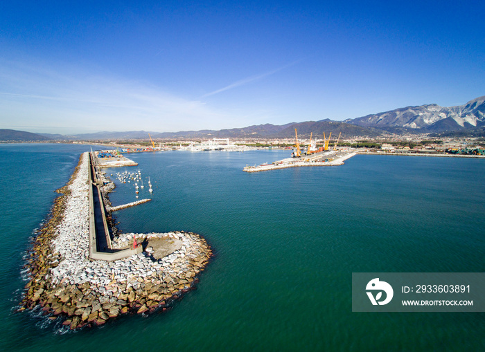 Italy, Tuscany: aerial view of the port in Marina di Carrara and in the background the Apuan Alps with the marble quarries