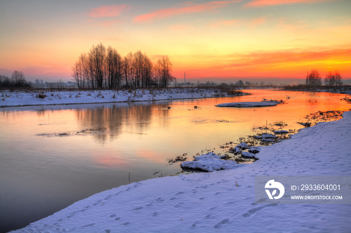 Winter landscape, amazing sundown in winter , Poland Europe, river valley Knyszyn Primeval Forest