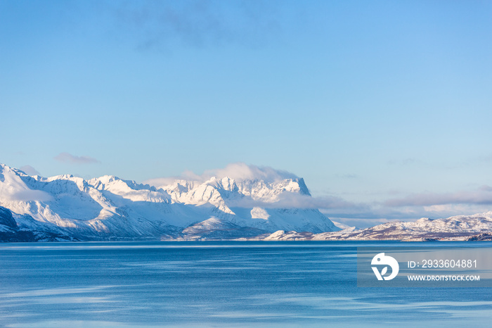 Beautiful winter landscape with mountains and fjord