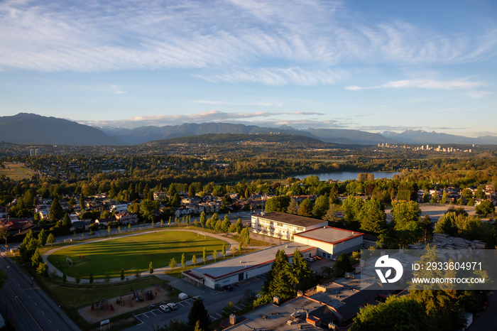 Aerial view of the modern city during a vibrant summer sunset. Taken in Burnaby, Greater Vancouver, BC, Canada.