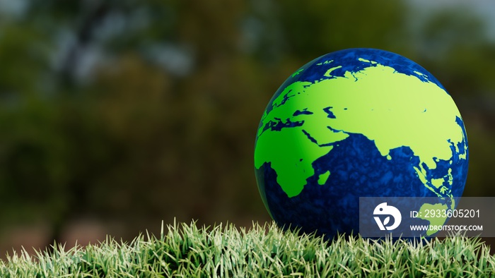 globe located on the ground with grass, showing europe, asia, africa and australia