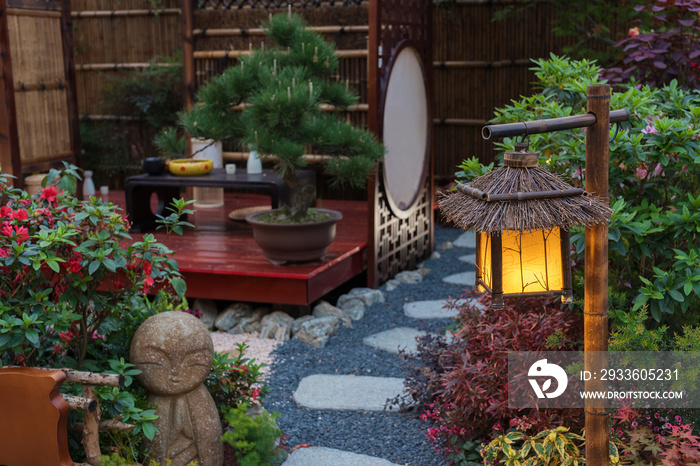 Lantern in beautiful oriental Japanese backyard garden