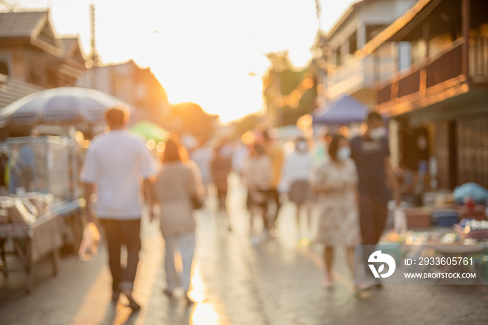 Blur people walking in shopping street sunset beautiful light for background