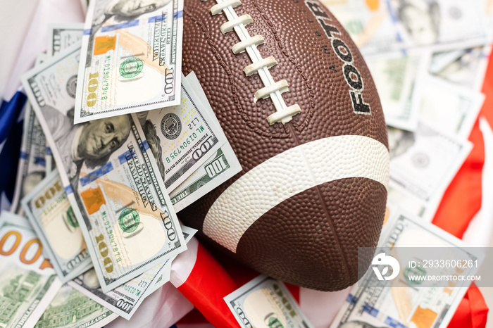 rugby ball and dollars on american flag