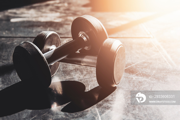 Gym equipment close up dumbbells on floor for background