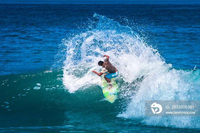 The Village Of Montanita. Ecuador. Pacific ocean. Surfer training. The athlete does tricks on the longboard. Surfer riding the wave. Aquatics. Extreme sport. The Beach Of Montanita. Surfing in Ecuador