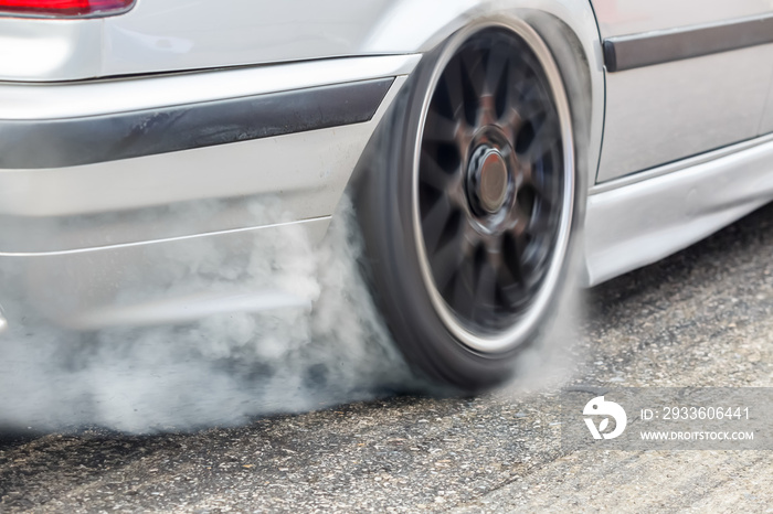 Race drift car burning tires on speed track