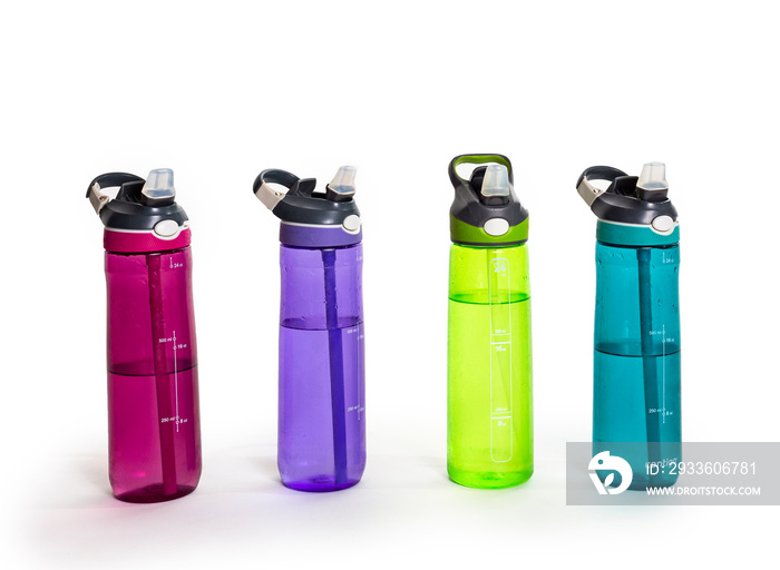 A row of colorful water bottles filled with water. Isolated on a white background.