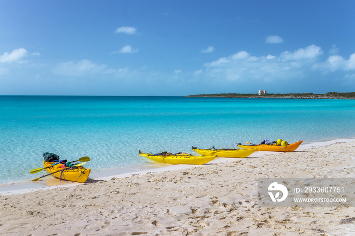 Kayaks by a tropical ocean in the Bahamas