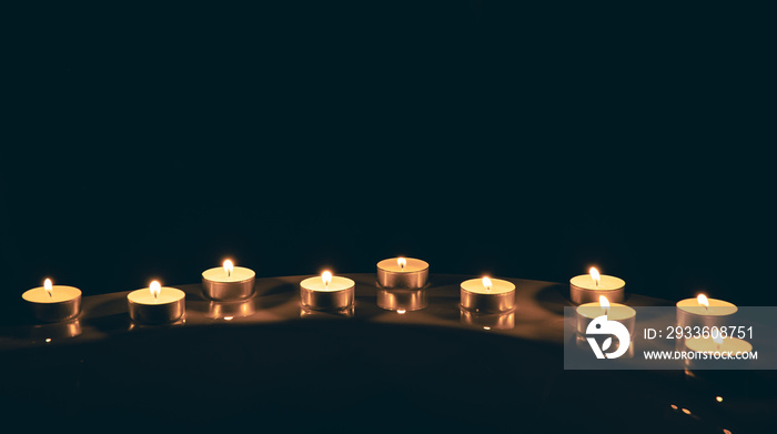 Burning candles in the bathroom in the dark.