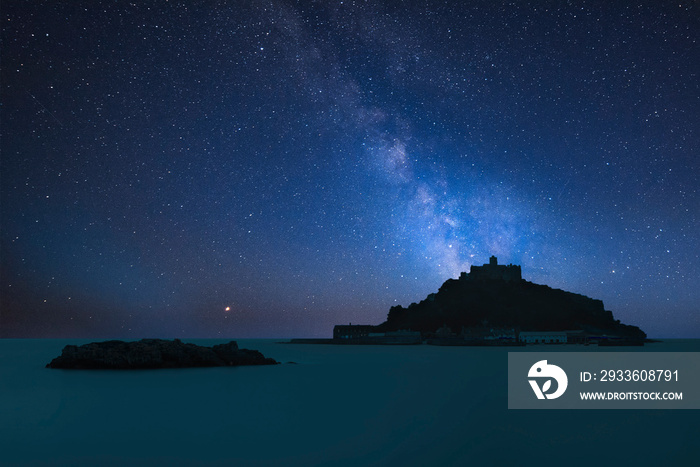 Vibrant Milky Way composite image over landscape of St Michael’s Mount Bay Marazion Cornwall England