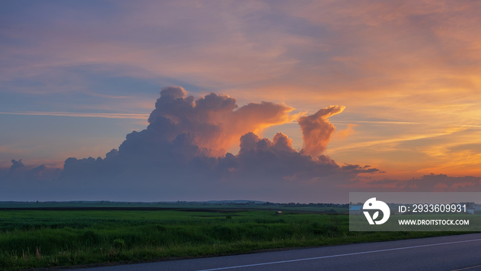 Summer sky with fanciful cumulus clouds over Rivne region, Velyka Omelyana, Ukraine.