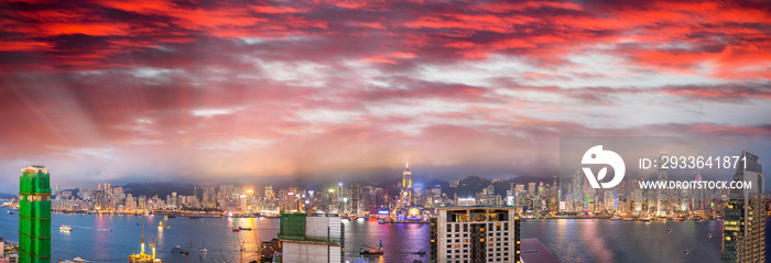 Amazing night panoramic view of Hong Kong skyline from Kowloon Tower at sunset