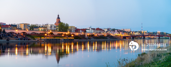 Gorzow Wielkopolski city evening skyline seen across Warta river. Poland