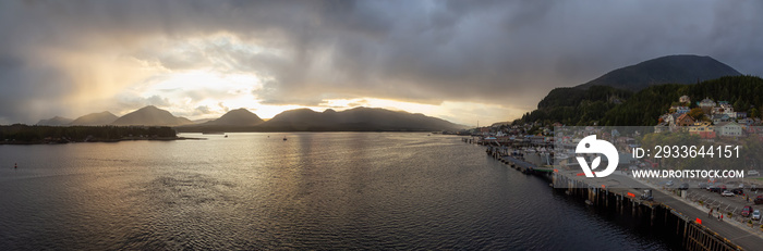 Beautiful Panoramic Aerial View of a small touristic town on the Ocean Coast during a stormy and rainy sunset. Taken in Ketchikan, Alaska, United States.