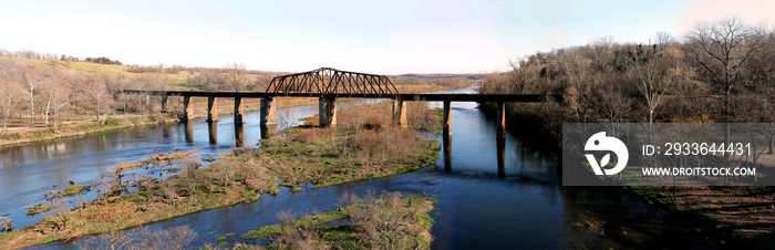 Historic iron swing bridge over the White River, near Cotter Arkansas. Old steel truss bridge built in 1905, stretches 285 feet long.