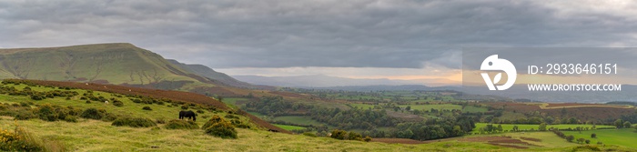 View over the landscape of the Brecon Beacons National Park on a cloudy day, seen from Hay Bluff car park in the Black Mountains, Powys, Wales, UK