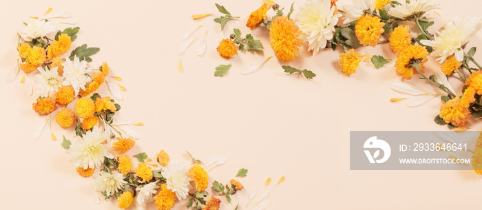 orange chrysanthemums on yellow paper background