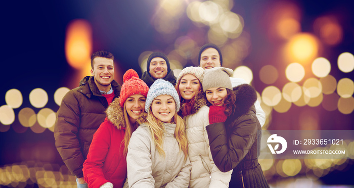 happy friends taking selfie outdoors at christmas