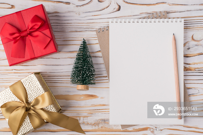 Christmas holidays concept. Top above overhead view flat lay photo of a blank notebook pencil small 