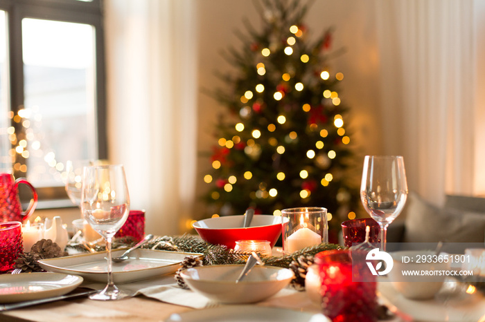 christmas, holidays and eating concept - table served for festive dinner at home