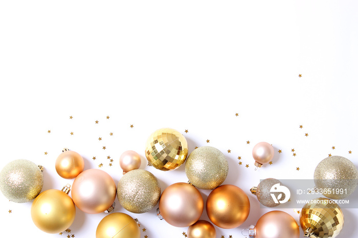 A lot of beautiful decorative Christmas balls on a white background, top view with place for inserti