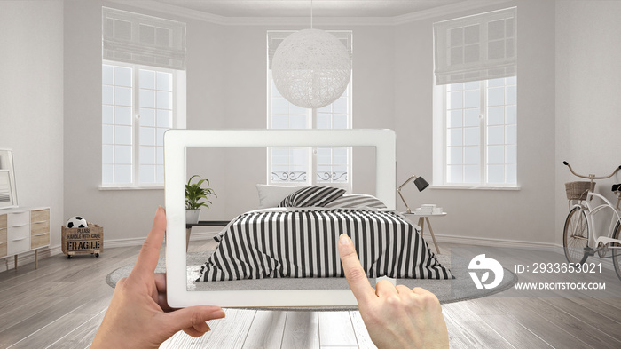 Augmented reality concept. Hand holding tablet with AR application used to simulate furniture and in