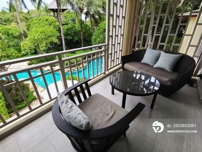 Relax chairs on the balcony for relaxing outside the room with Garden and pool view.