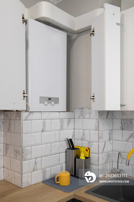 Gas boiler water heater installated in kitchen furniture