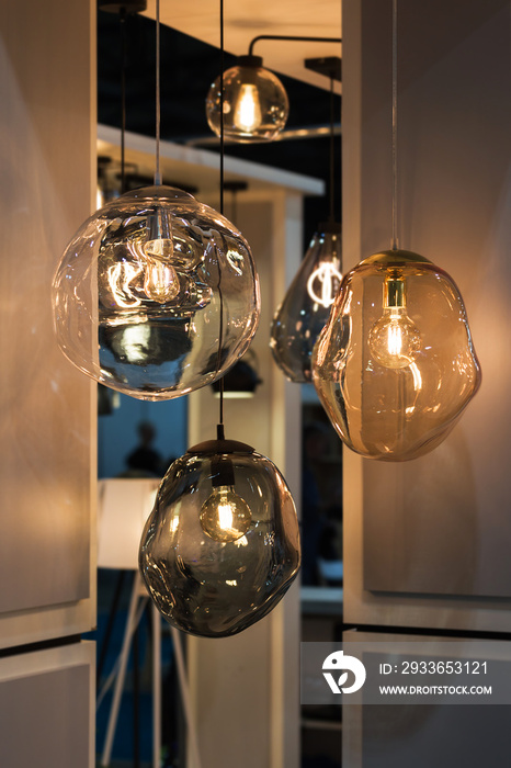 Different modern streamlined mirror glass chandeliers. Bubble transparent, metal, gold shade pendant
