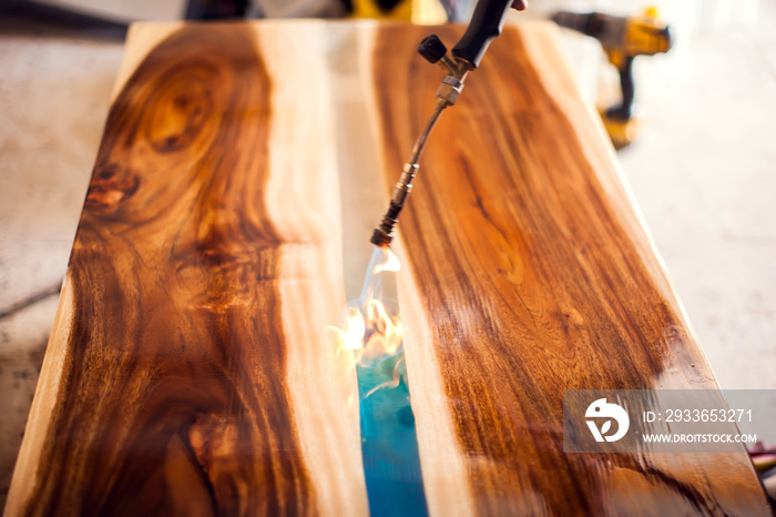 Treatment of wood with epoxy and varnish. manufacturing of furniture from solid