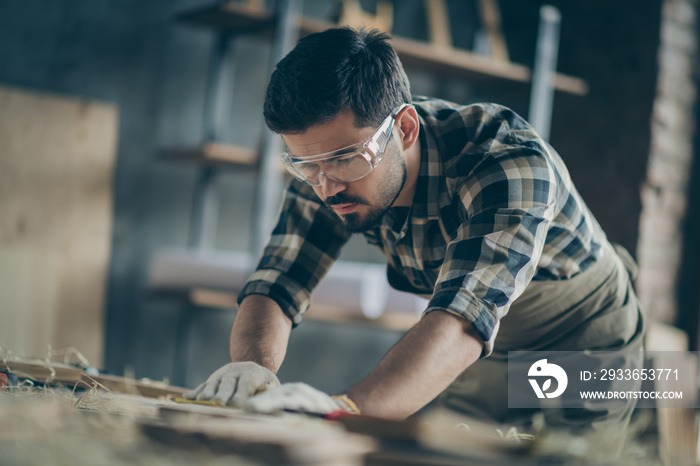 Portrait of his he nice attractive focused concentrated skilled experienced hardworking guy builder 