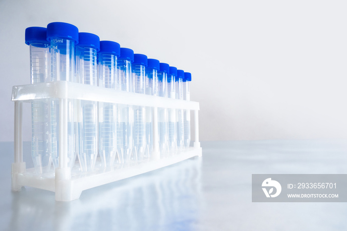 Empty plastic test tubes on table. Disposable medical utensils. Disposable blood test tubes. Labware