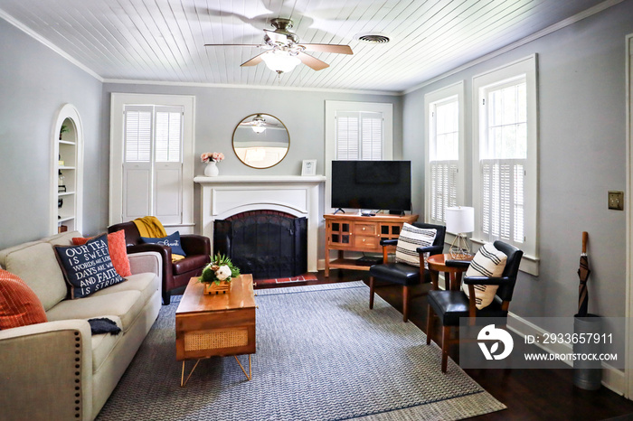 A clean and classic airy living room of a small cottage short term rental