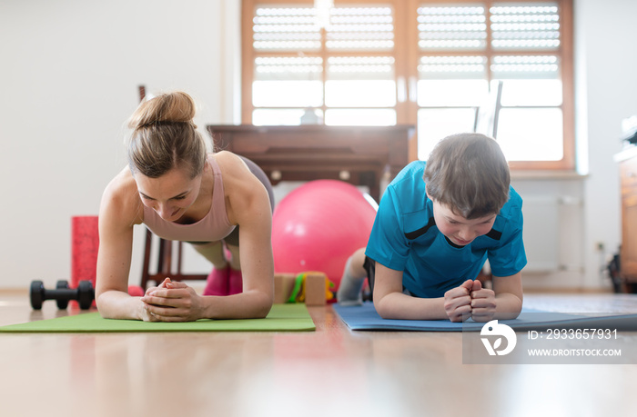 Family in self quarantine during Covid-19 crisis staying fit at home