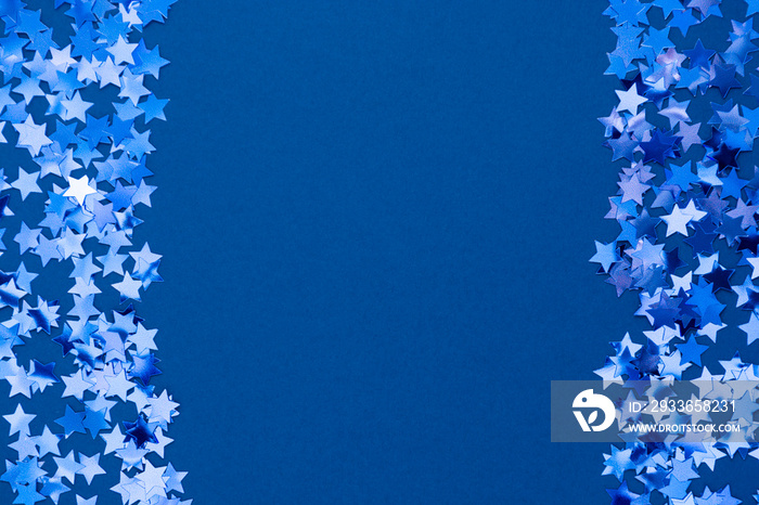 Blue abstract Christmas background border, frame texture with stars confetti on blue background. Spa