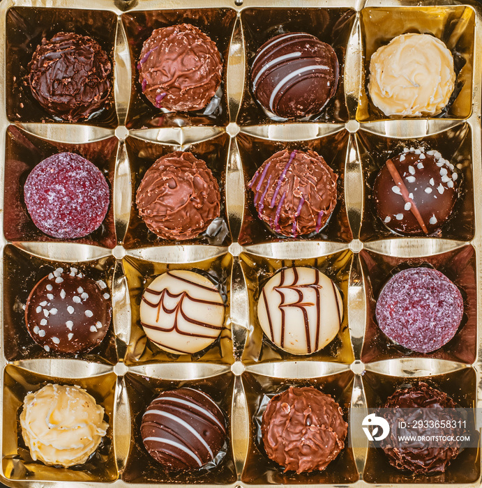 chocolate candies in the box, top view