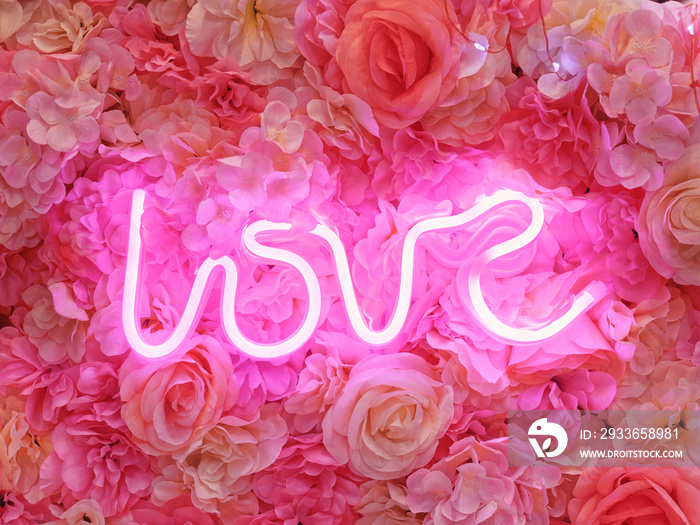 Love Neon sign light with pink roses background Valentine wedding decoration