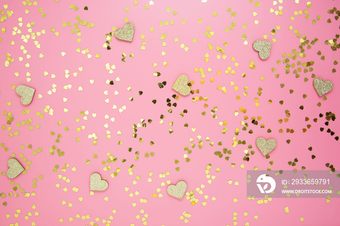 Table top view valentines day pink background. Flat lay arrangement of hearts and golden glitter. V