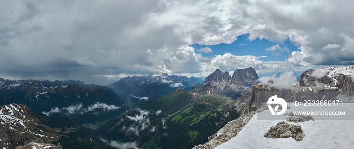 Panoramic view of the Dolomites Alps and Fassa Valley, Italy. Thunderstorm and rain over the mountains