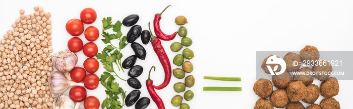 top view of chickpea, garlic, cherry tomatoes, parsley, olives, chili pepper, green onion and falafel on white background, panoramic shot