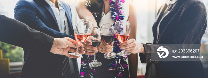 Men and women drink wine In celebration of the new year or the success of the company.