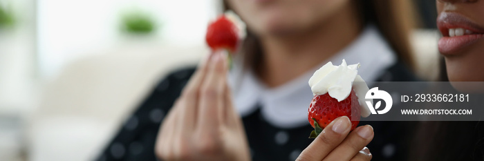 Afro american young woman hold strawberry with whipped cream