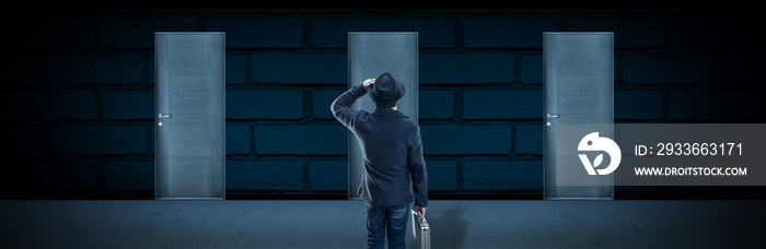 a man in a hat stands in front of doors, the concept choosing the right door, panoramic image