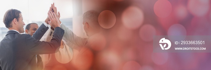 Business team putting hands together and red bokeh transition